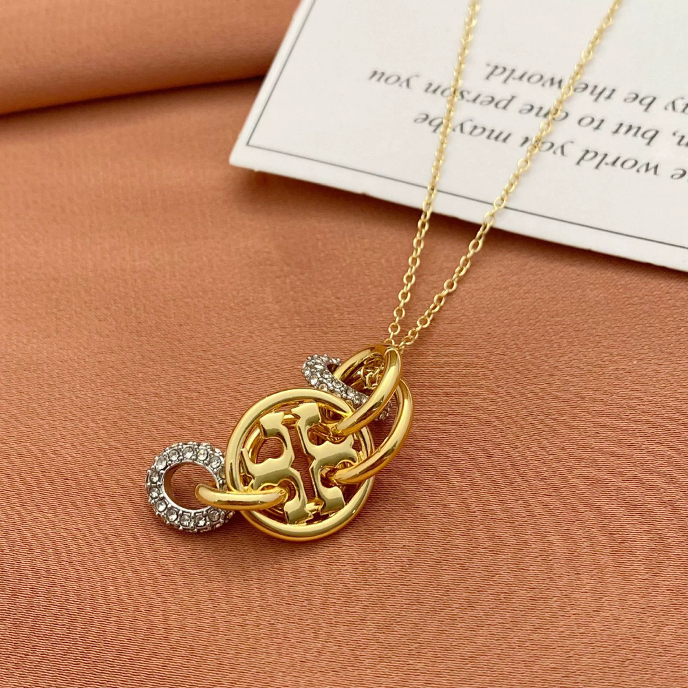 Tory Burch Rhinestone Hollow Round Pendant Metal Necklace